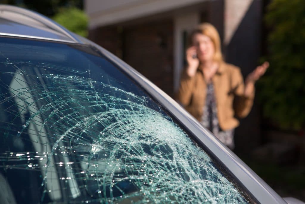 broken-windshield woman talking on the phone